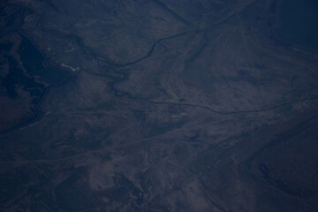 A view of the mountains from the height of an airplane. Beautiful scenery of nature, the beauty of the mountains.