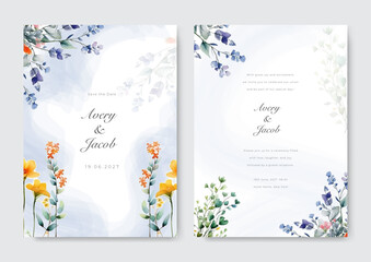 Corner of purple flower arrangement on wedding invitation background.