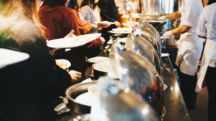 People hand grab buffet food serve in hotel seminar room