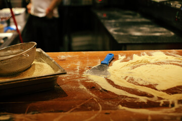 Immerse in flour, witness culinary artistry—a pizzeria's intimate revelation of craft and flavor.