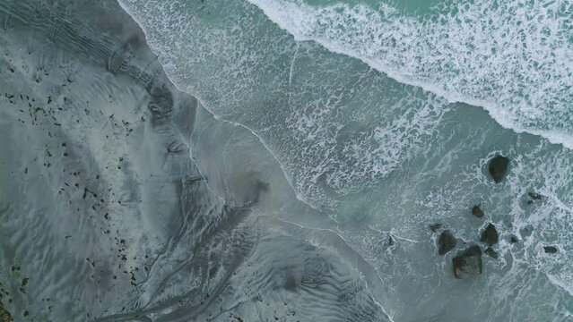 Aerial view of Skasenden with blue turquoise seawater, sea in island in summer season, Norway. Water in ocean material pattern texture wallpaper background.