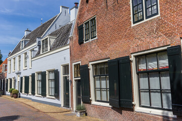 Fototapeta na wymiar Historic houses with shutters in the center of Loenen, Netherlands