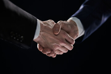 Close-up image of handshake between two colleagues.