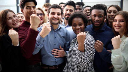 Obraz premium Confident diverse college students show fist up.
