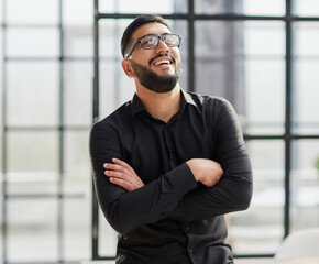 portrait of a young businessman who is smiling