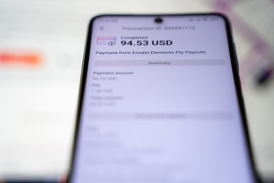 Payoneer app and payment from Envato Elements on smartphone screen. Ankara, Turkey - June 14, 2023.