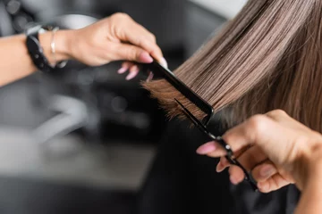 Foto auf Glas close up of scissors and comb, salon hair tools, cropped view of professional hairdresser cutting short brunette hair of woman, beauty worker, haircut, beauty salon work, hairdo © LIGHTFIELD STUDIOS