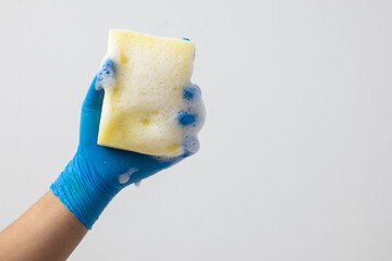 Put on gloves and hold a sponge to clean.