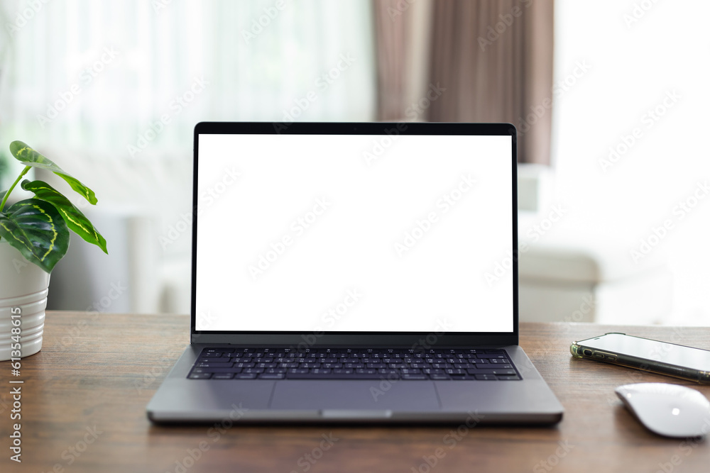 Wall mural mock up empty screen computer on wood desk in home.notebook laptop with blank screen