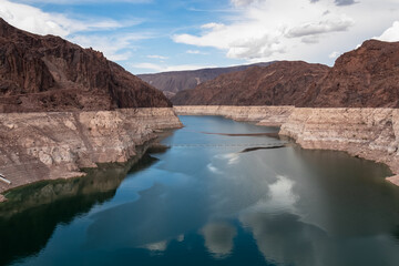 Fototapeta na wymiar Scenic view of Colorado River seen from Hoover Dam near Mike O'Callaghan Pat Tillman Memorial Bridge, Nevada Arizona, USA. Blue turquoise water from Lake Mead surrounded by River mountain range
