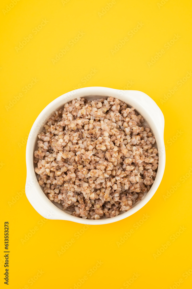 Poster boiled green buckwheat on a white bowl