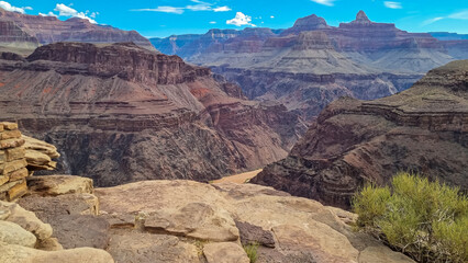 Panoramic aerial view of Colorado River weaving through valleys and rugged terrain seen from Plateau Point, Bright Angel Trail, South Rim, Grand Canyon National Park, Arizona, USA. Brown dirty water