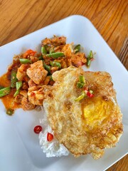 Rice topped with stir-fried pork and basil, Rice topped with stir fried minced pork and basil with Fried egg