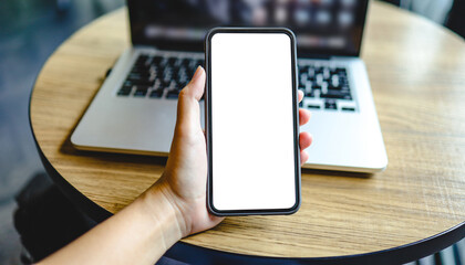 Women's hands holding cell telephone blank copy space screen. smartphone with blank white screen...