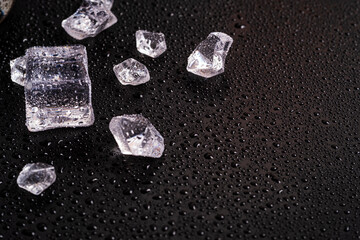 Ice cubes on a black background. Cold background. ice and won on black background