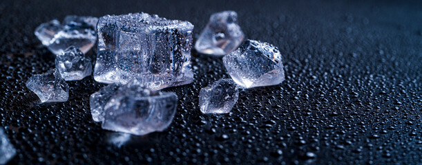 Ice cubes on a black background. Cold background. ice and won on black background