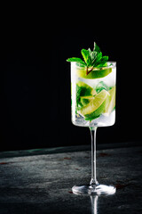 alcohol cocktail in a glass stands on a table in a bar or restaurant