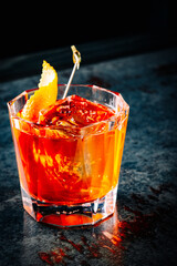 alcohol cocktail in a glass stands on a table in a bar or restaurant