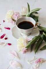 Obraz na płótnie Canvas Coffee for breakfast with flowers on white table