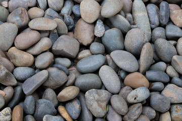 Close up of stone pile in the garden background.
