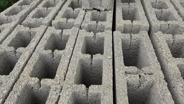 Stack of concrete bricks blocks on the palette at warehouse close up