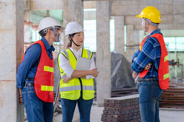 team of civil technician engineers discuss the timeline with architect foreman worker while inspecting, check safety infrastructure construction progress for sustainable green building at project site