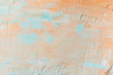 Fototapeta na wymiar Orange paint on a concrete wall