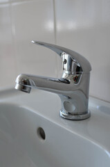 chrome faucet and sink in the bathroom.