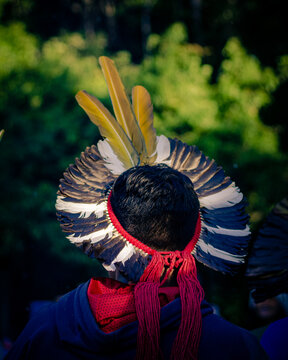 Sao Paulo, SP, Brazil - November 15 2021: Indian woman with colorful feather headdress details.