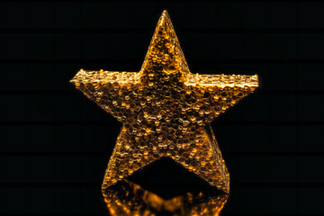 one gold star, on a black background