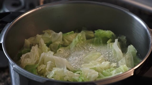 close up of vegetable cooking in a pot, healthy food
