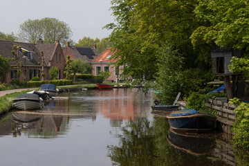 Fototapeta na wymiar The Angstel River flows through the picturesque Dutch town of Abcoude.