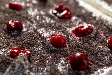 Making a Napoleon cake with poppy seeds and cherries
