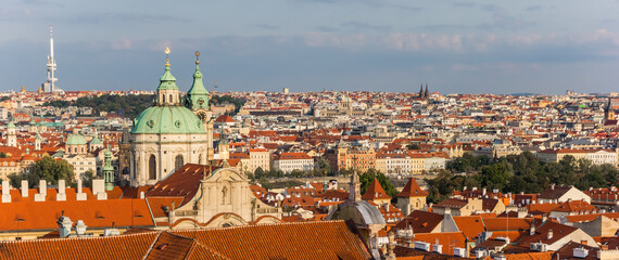 Naklejka na ściany i meble Panoramic view over the Nicholas church in the historic city of Prague, Czech Republic