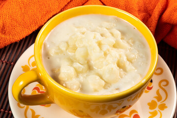 cup of canjica, typical food consumed in the Brazilian Festa Juninas