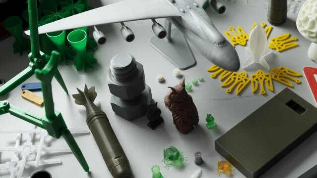 Collection of bright colorful objects printed on a 3d printer. Variety of plastic products manufactured by 3D printing. Modern printing technology