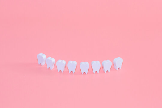 Healthy white teeth, tooth protection from tooth decay, gums with teeth, smiling tooth, character for dentistry. Dental concept banner with copy space. Children's toy doctor