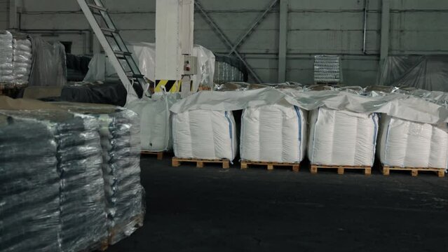 Cloth Bags, Harvest Packaging, Harvest Storage. Plant's warehouse at company is stacked high with countless bags of harvest products.