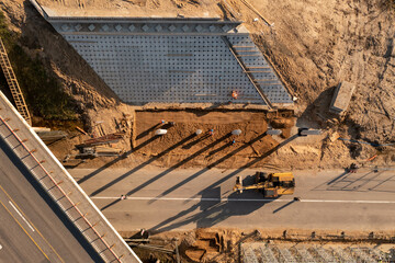 Drone photography of highway bridge being built during spring day