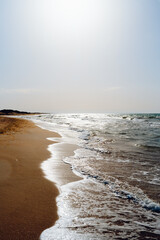 Seascape or ocean coast. Waves on the sand. Summer vacation travel concept - 613608237