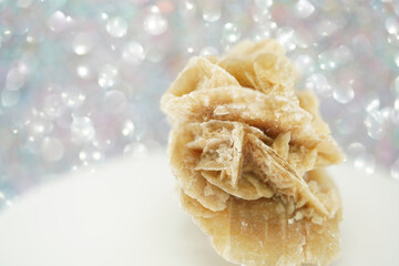 Gypsum rose with a crystal on a cut out background, Crystals resembling the shape of rose