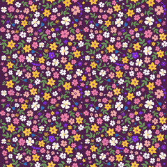 Trendy seamless botanical textile print.Small multi-colored flowers on a dark background seamless pattern for fabric, paper. Vector, hand drawn, Floral fashion pattern, ditsy print