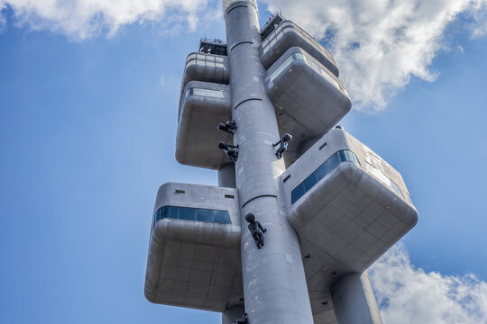 Zizkov Television Tower in Prague (1985 &ndash; 1992) with sculptures of babies crawling up and down the steel columns (by Czech artist David Cerny). Prague, Czech Republic. June 9, 2023.