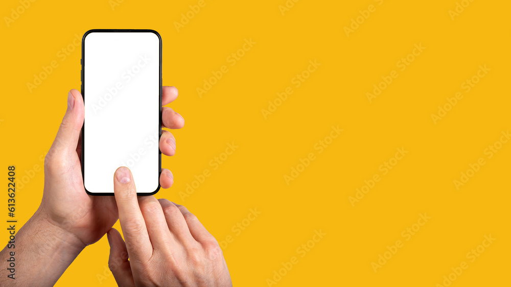 Poster hand holding mobile phone, finger clicking on blank screen mock-up. banner background with copy spac
