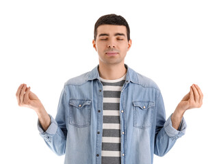 Young man meditating on white background. Balance concept