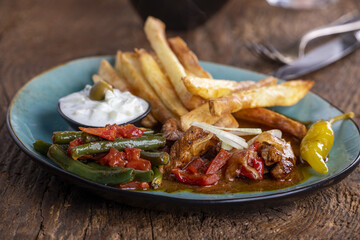 greek gyros with metaxa sauce and fries