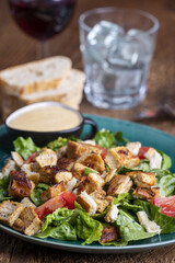 caesar salad on a green plate