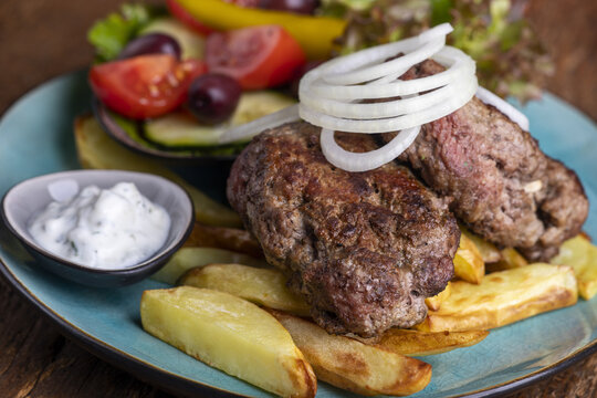 greek bifteki with salad and fries