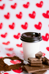 white coffee cup with coffee heart and chocolate pieces