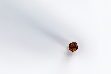 One cigarette lying on the table out of focus.